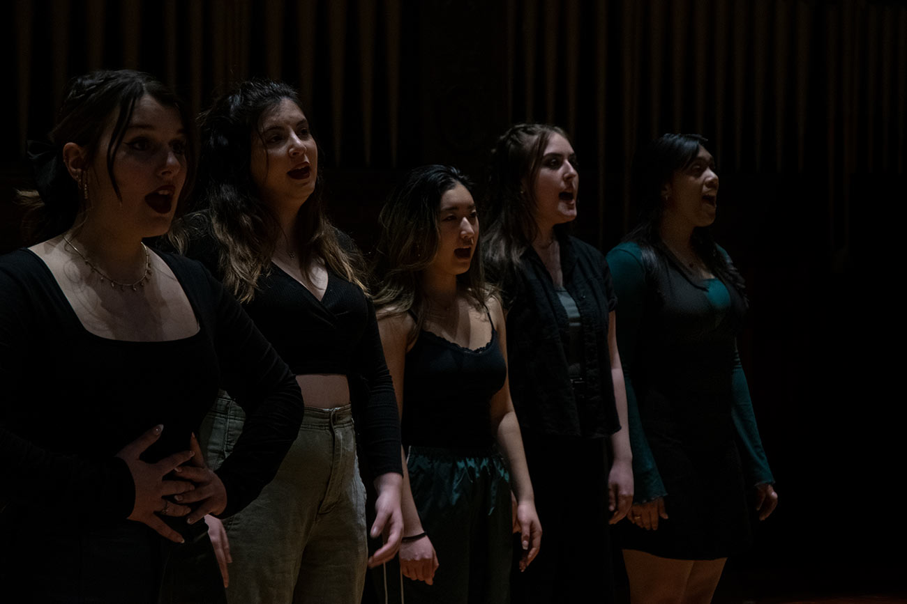 close up of Drexel University Treblemakers acapella group girls singing