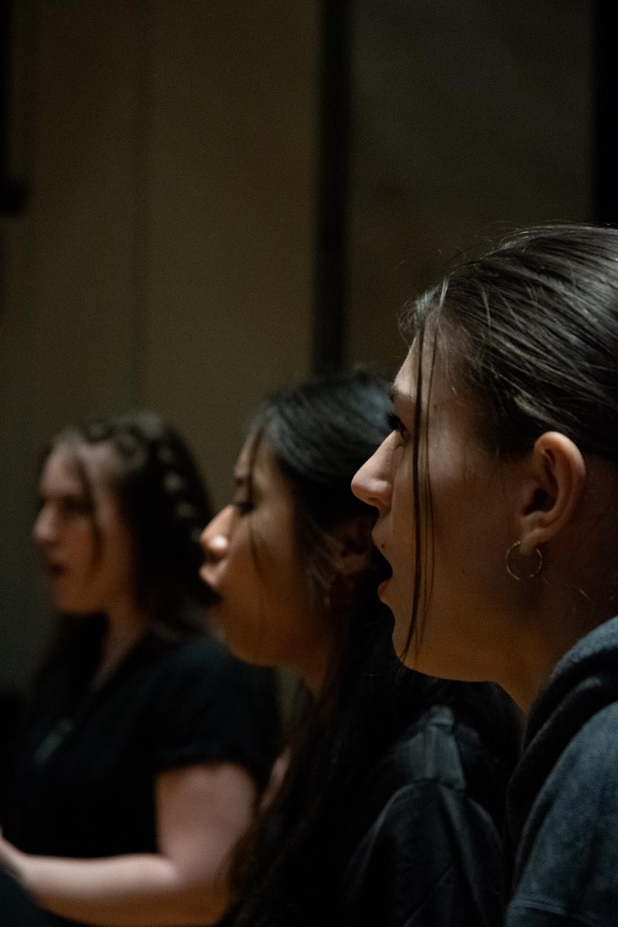 Extreme close up of girls singing at acapella rehersal